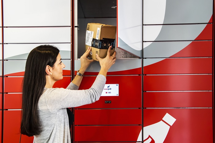 A person collecting a parcel from an EasiPik locker